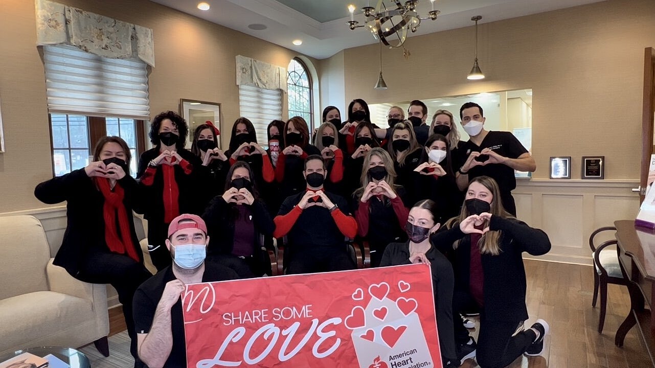 Group showing hearts and love for charity.
