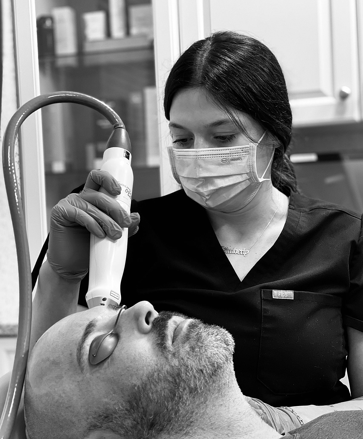 Skin treatment session in a clinical setting.