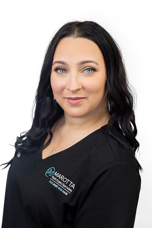 Medical professional with long dark hair.