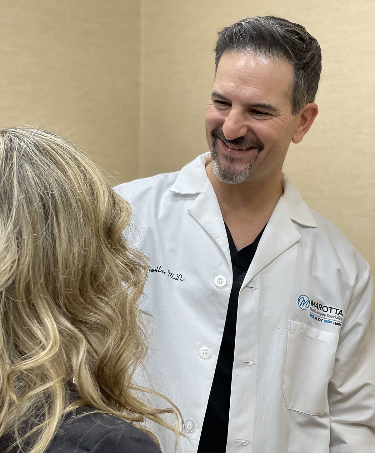 Doctor consulting with patient in medical setting.