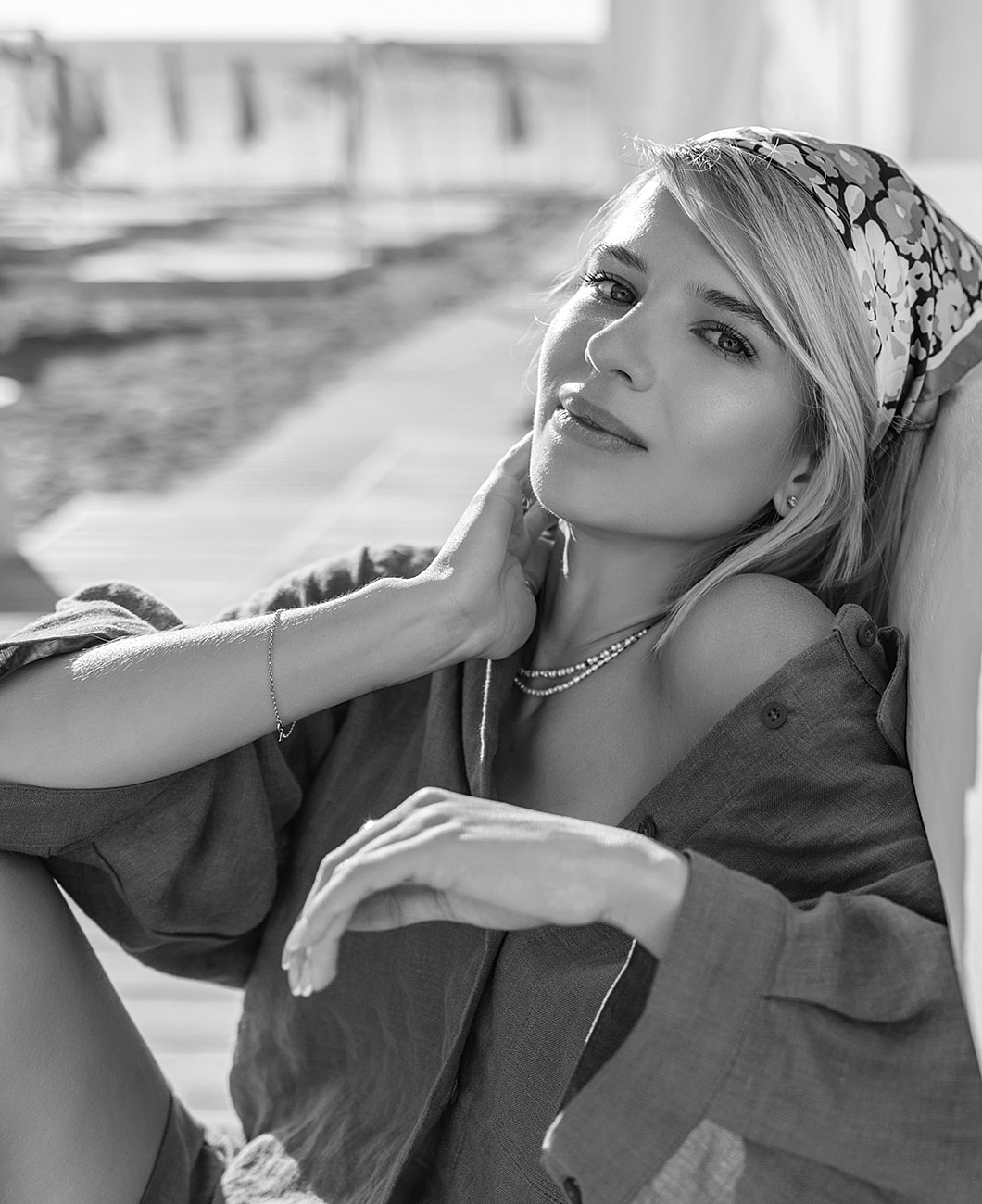 Woman in casual attire posing thoughtfully.