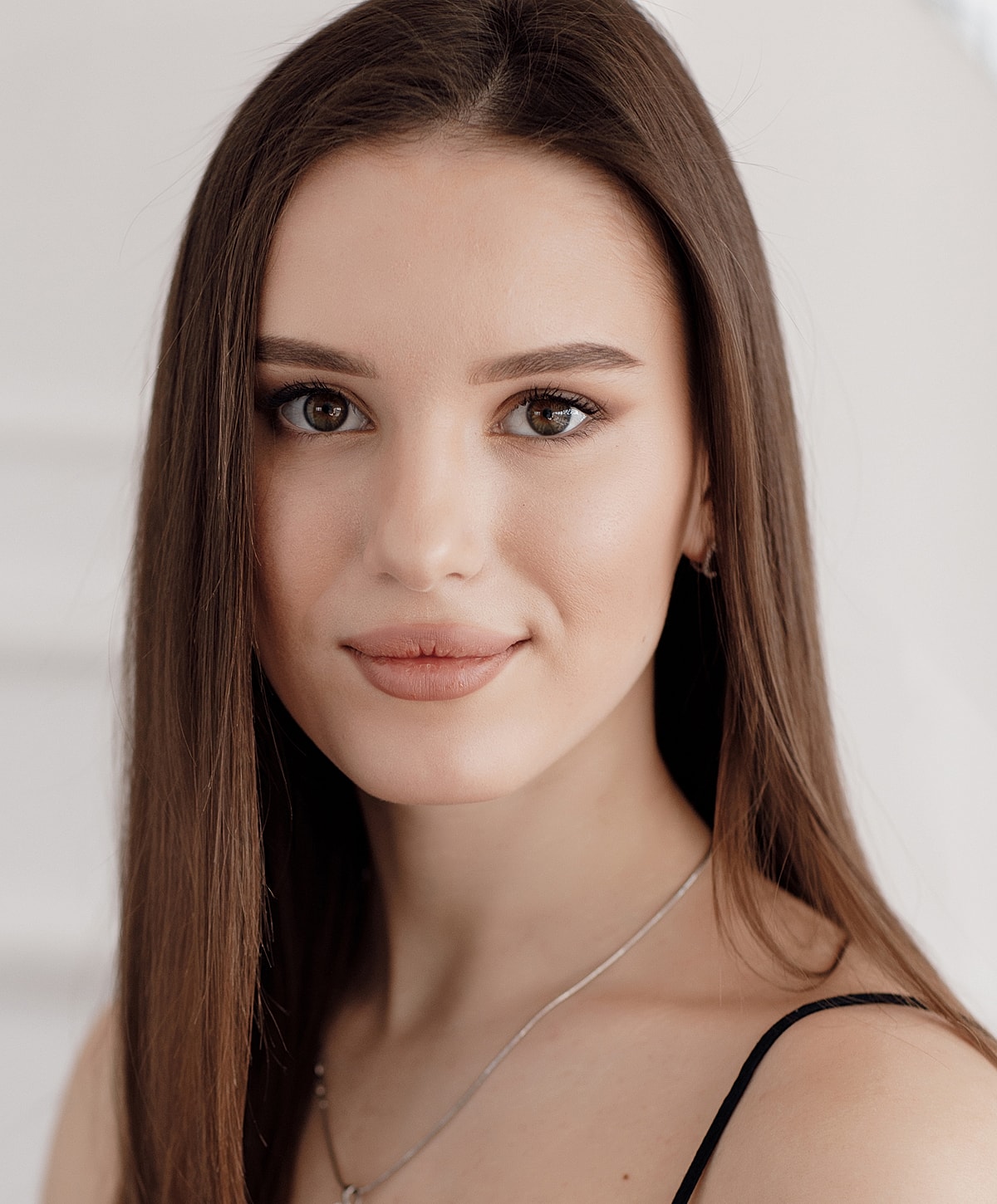 Portrait of a woman with long brown hair.