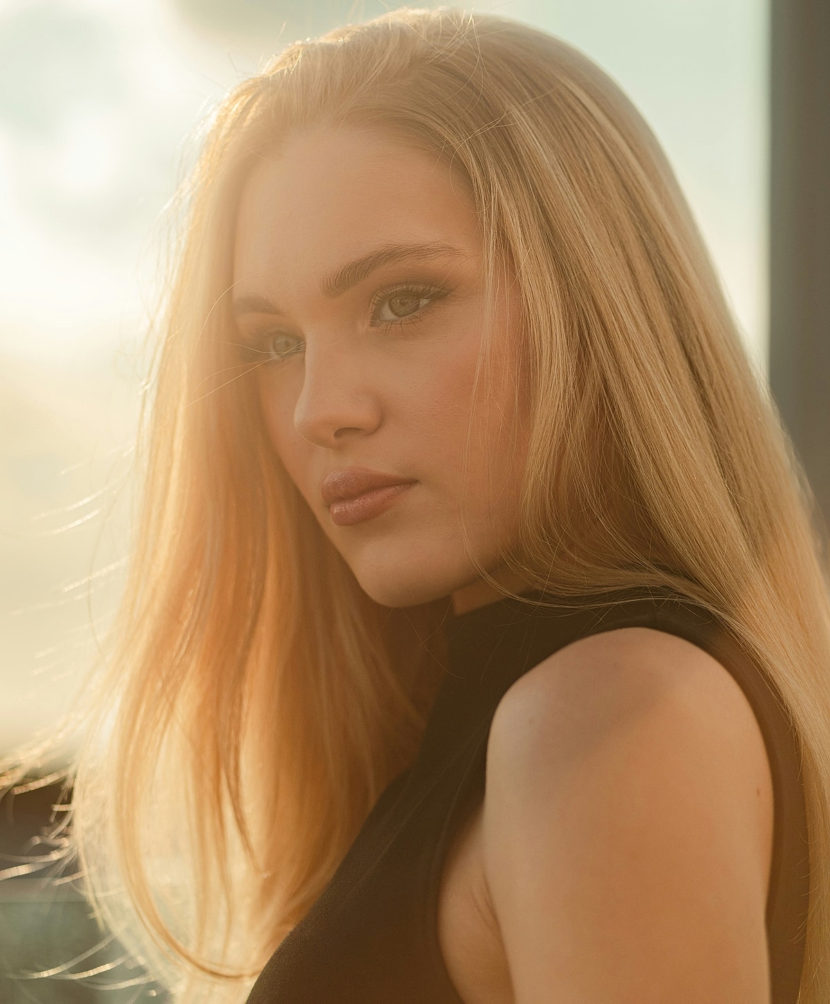 Portrait of a woman with long blonde hair.