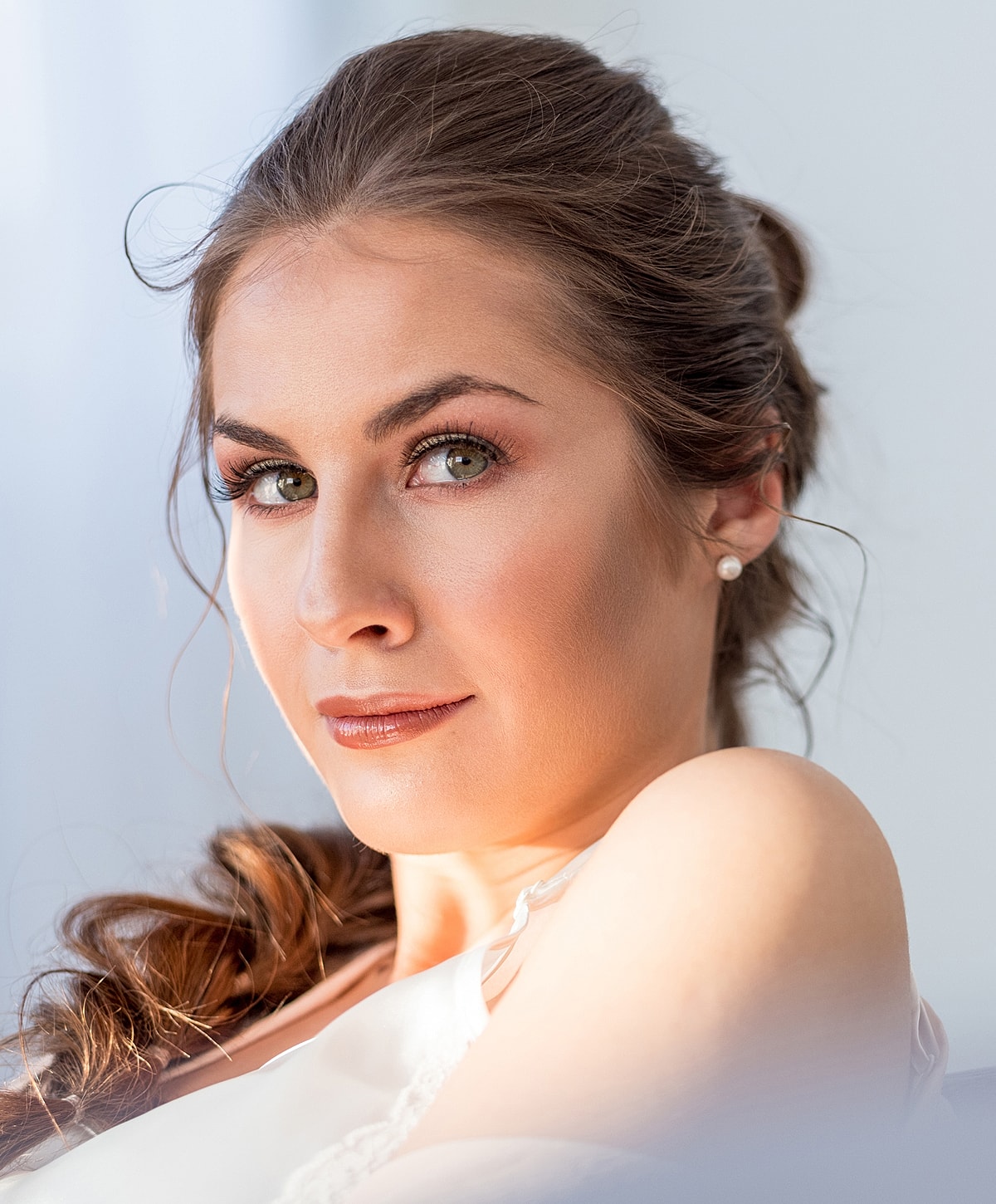 Portrait of a woman with elegant hairstyle and makeup.