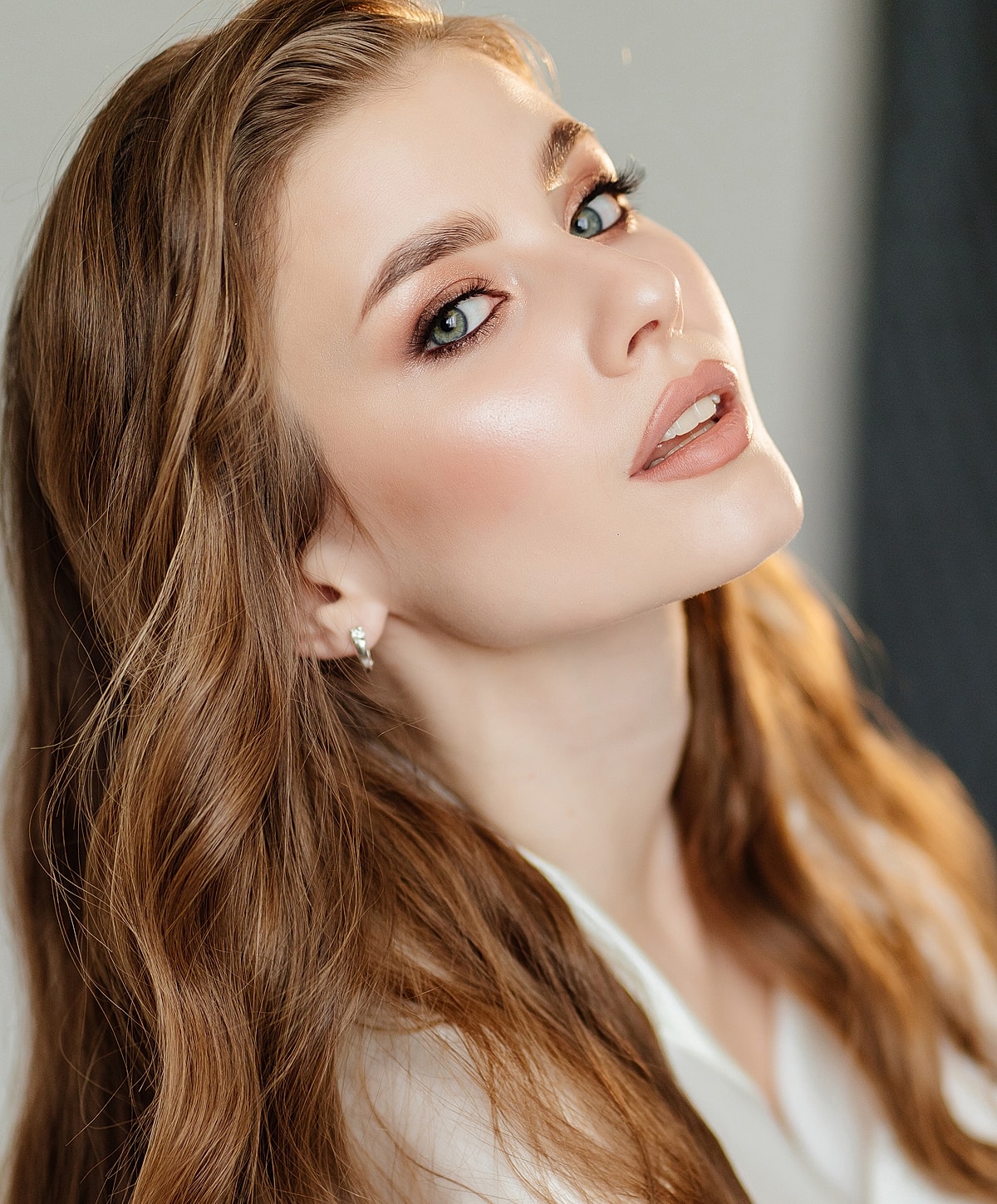 Portrait of woman with long, wavy hair.