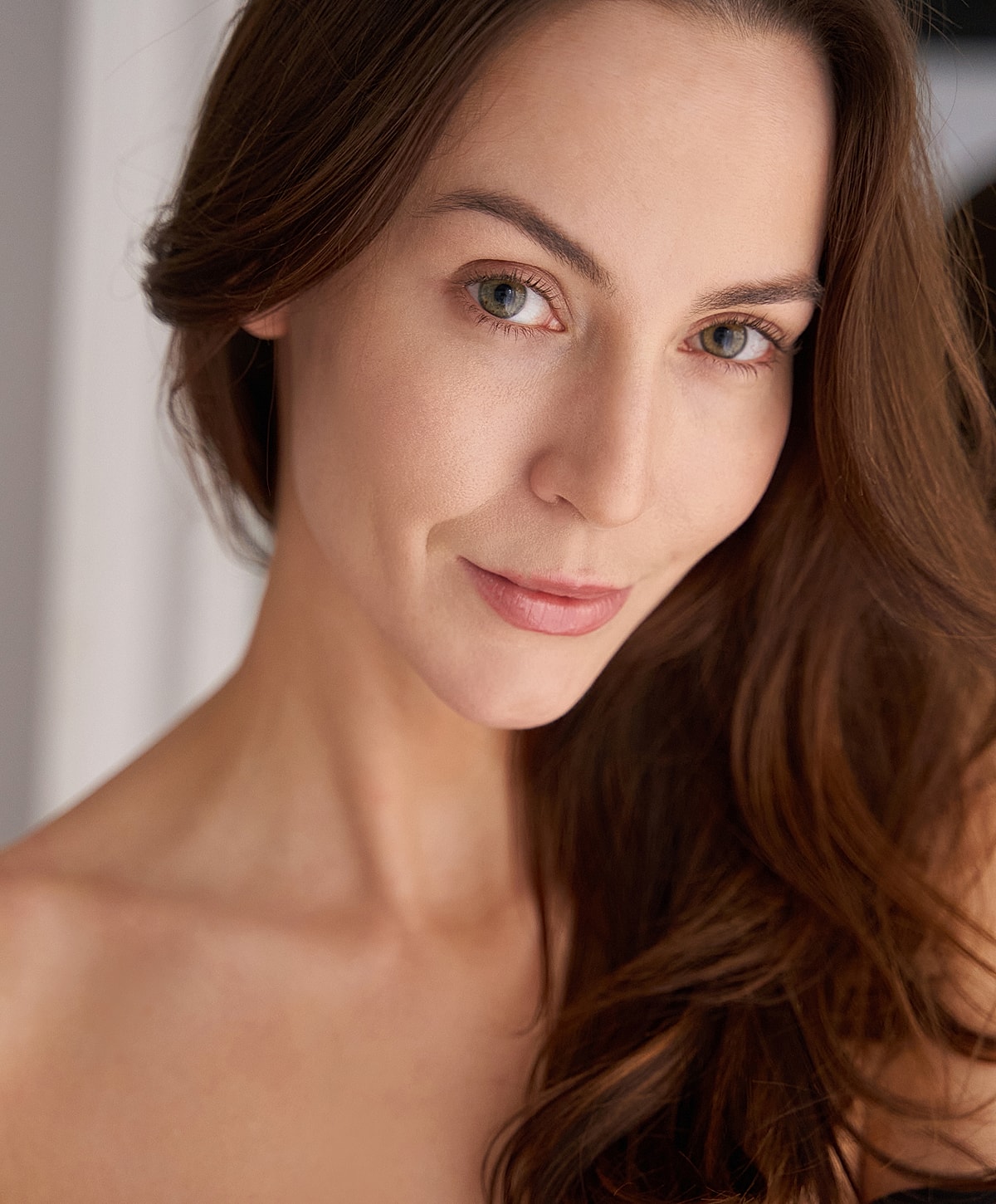Close-up portrait of a woman with long hair.