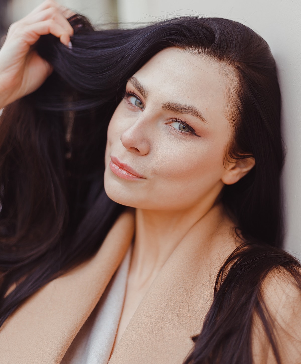 Woman with long dark hair and subtle smile.