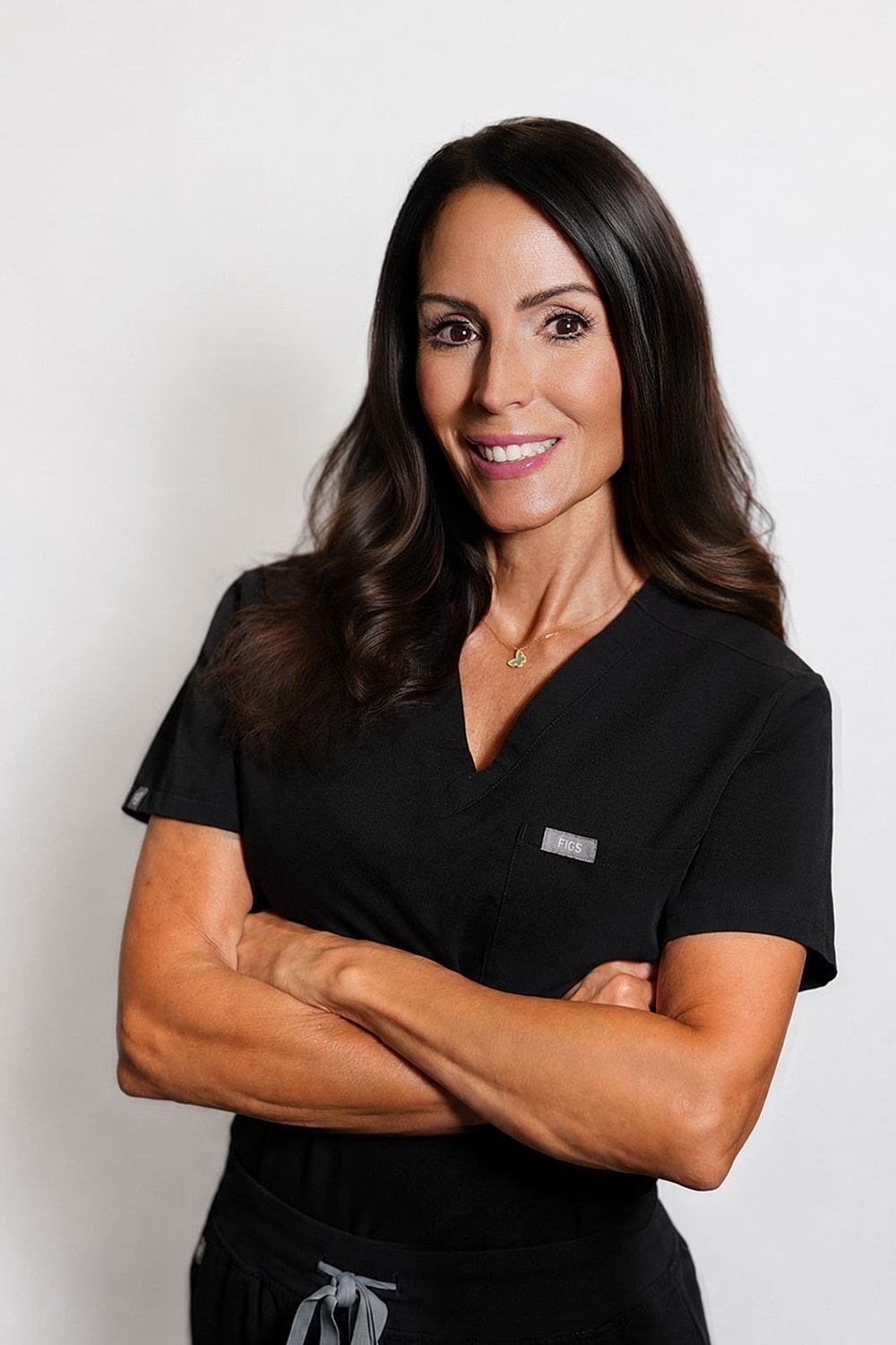 Professional woman in black medical scrubs.