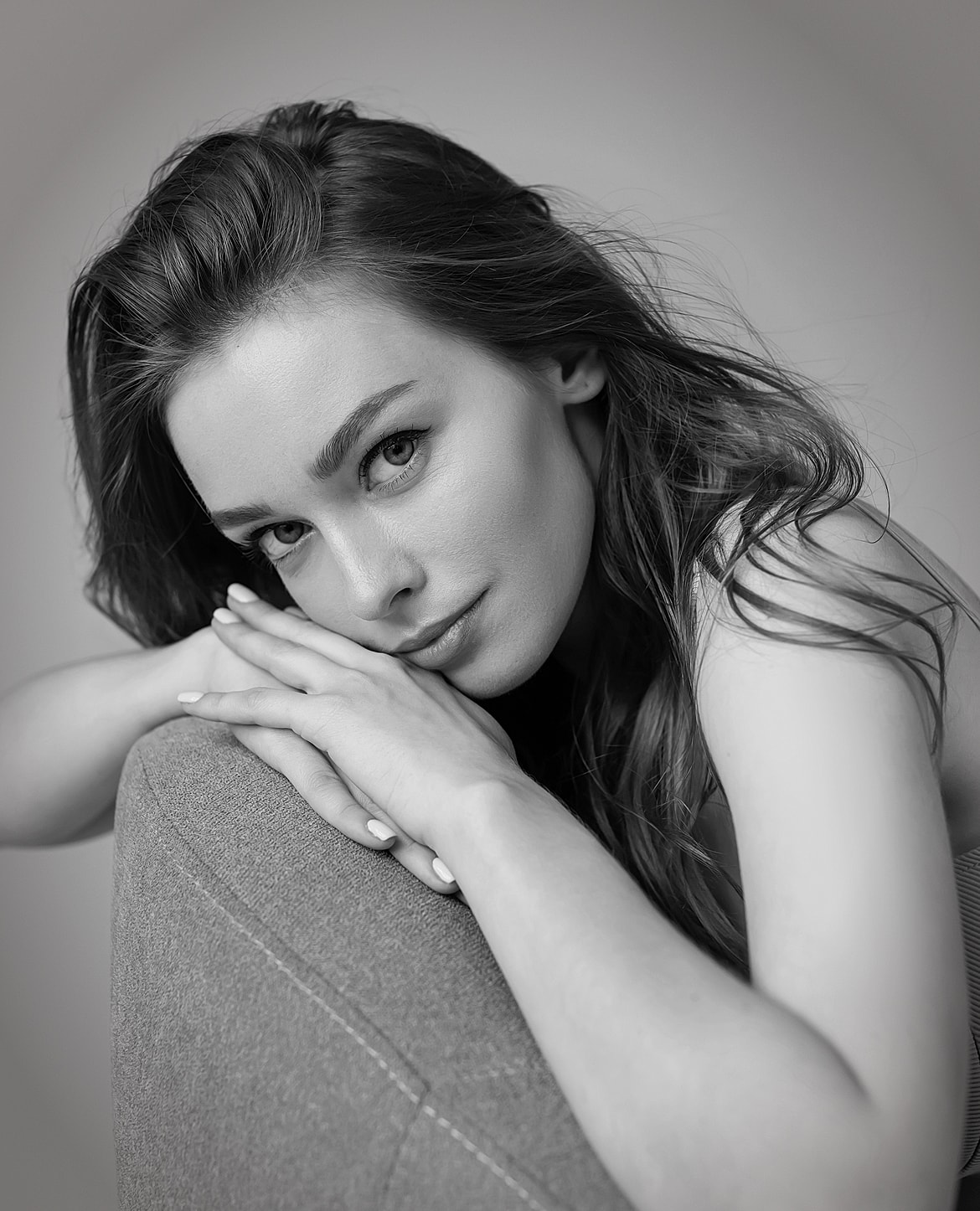 Black and white portrait of a thoughtful woman.