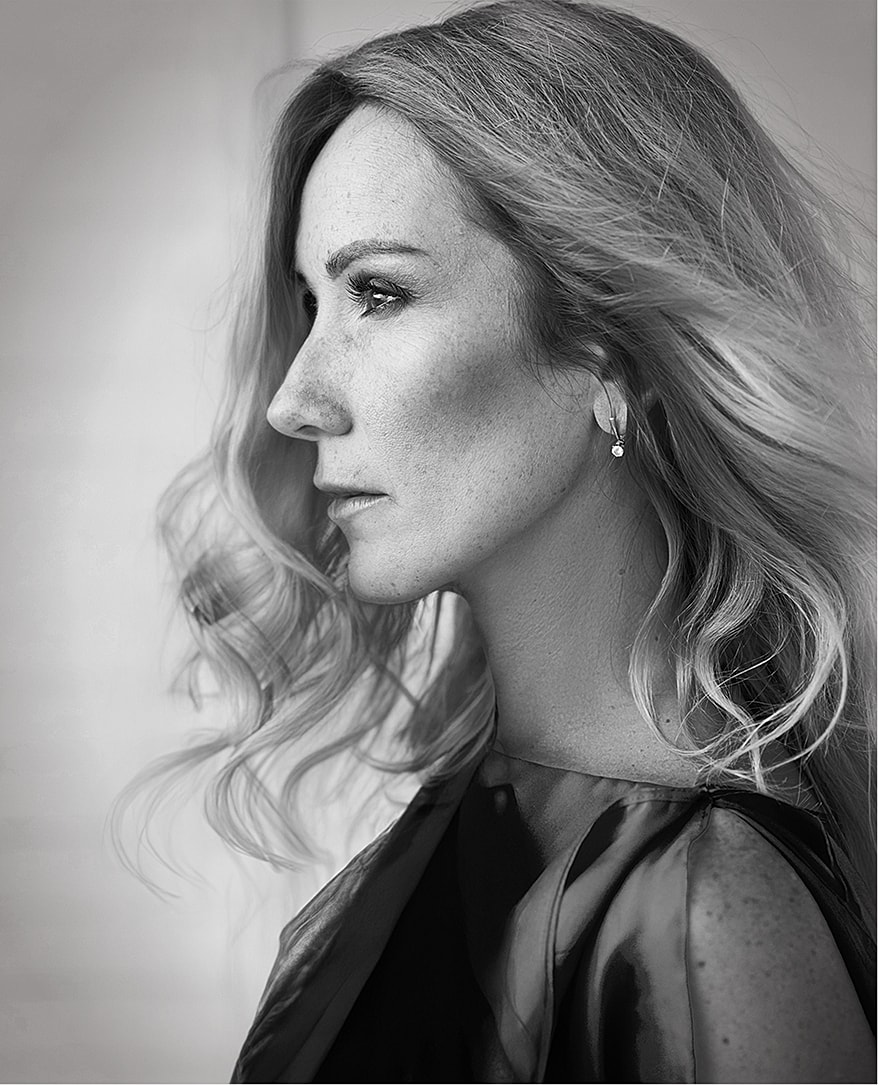 Profile portrait of a woman in black and white.