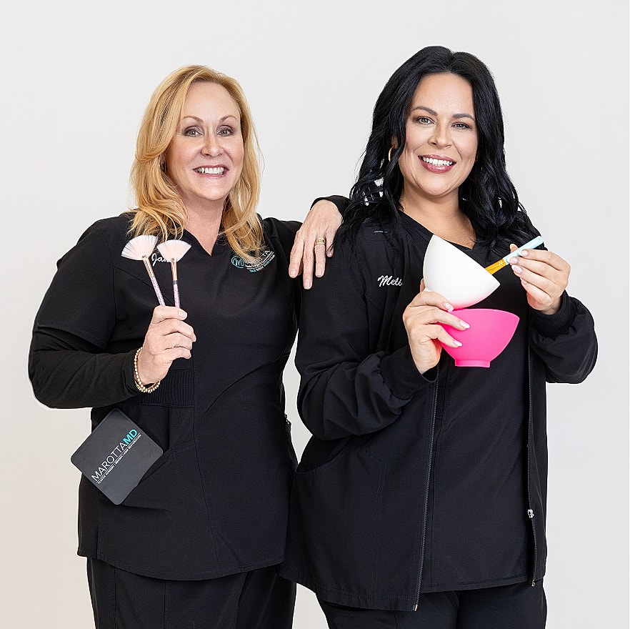 Two professionals with beauty tools and products.