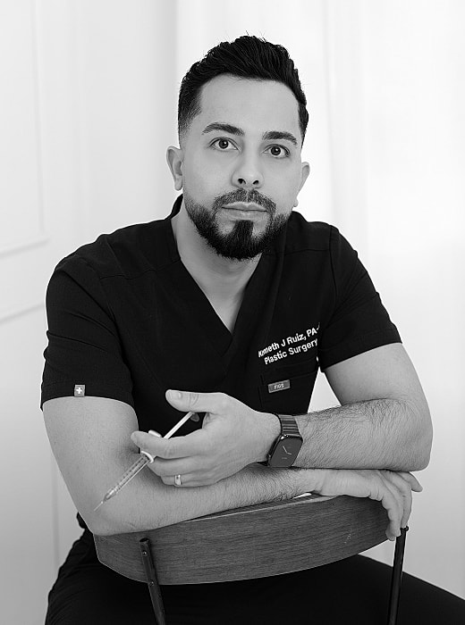 Male healthcare professional in black scrubs.