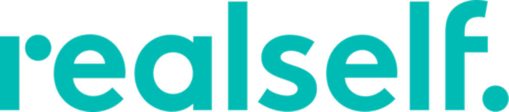 Logo of RealSelf brand in turquoise color.