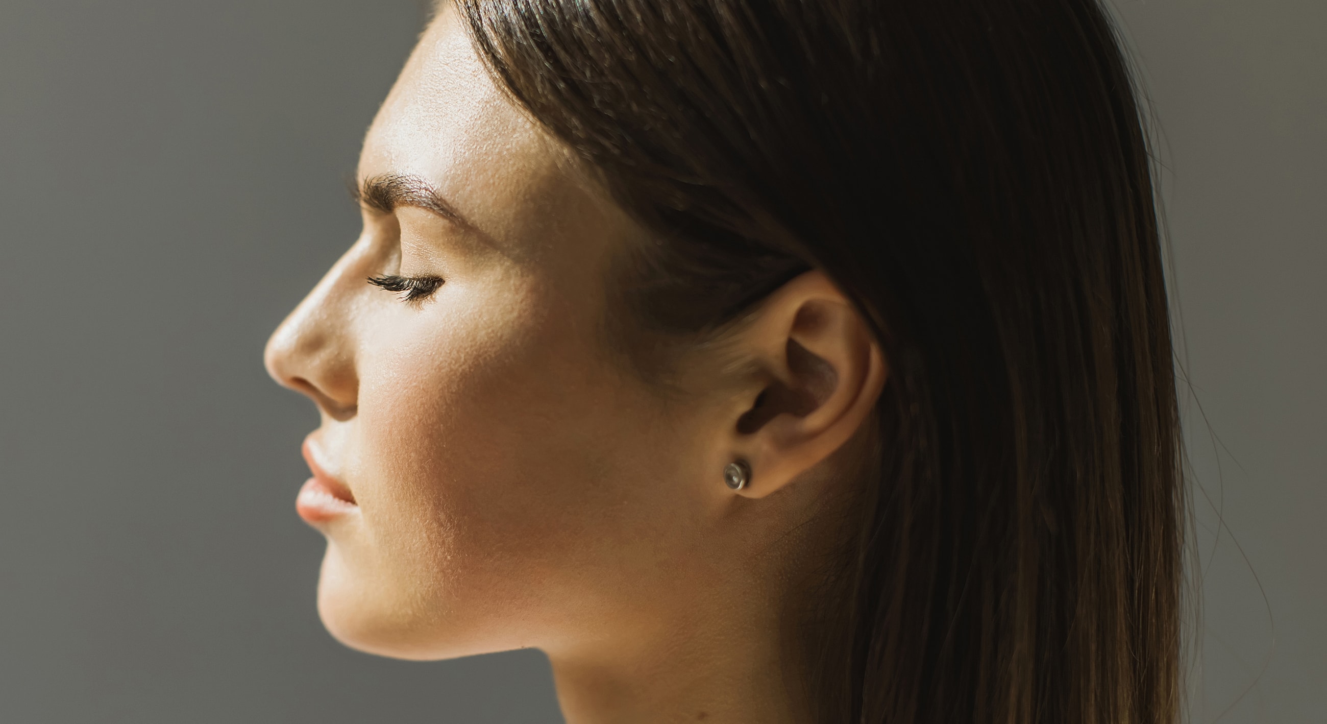 Profile view of a woman with closed eyes