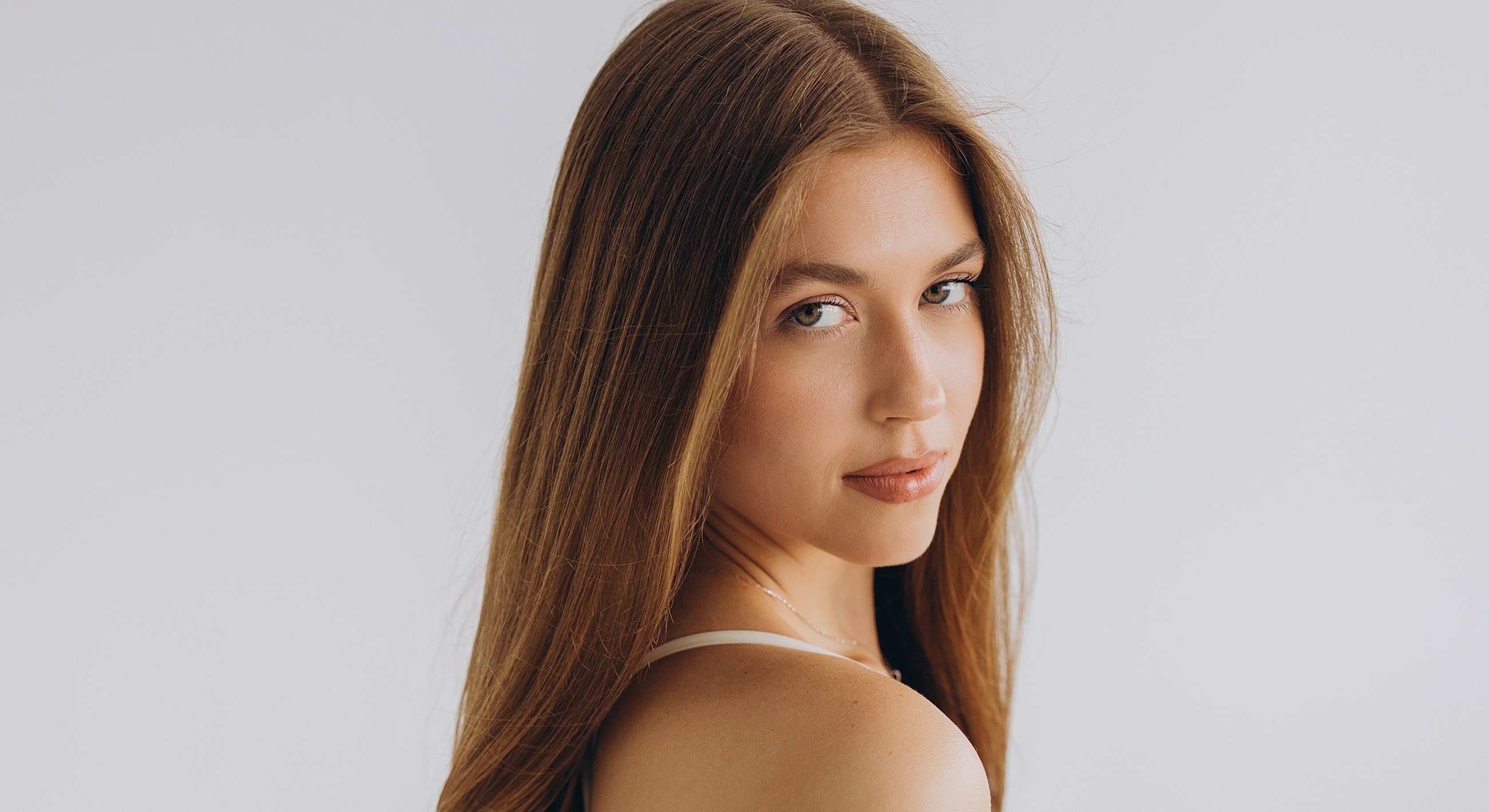 Portrait of a woman with long, flowing hair.
