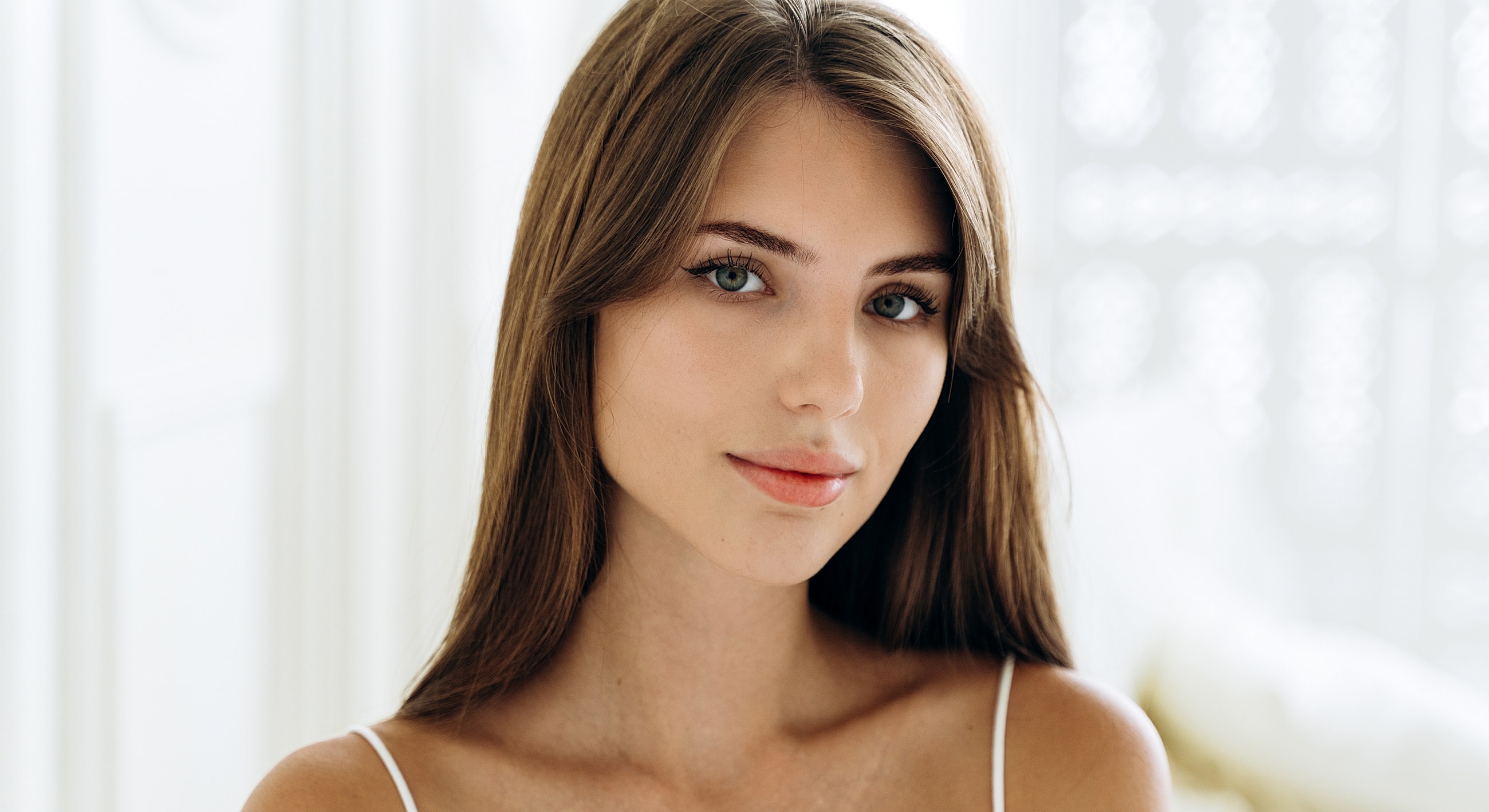 Portrait of a young woman with long hair.