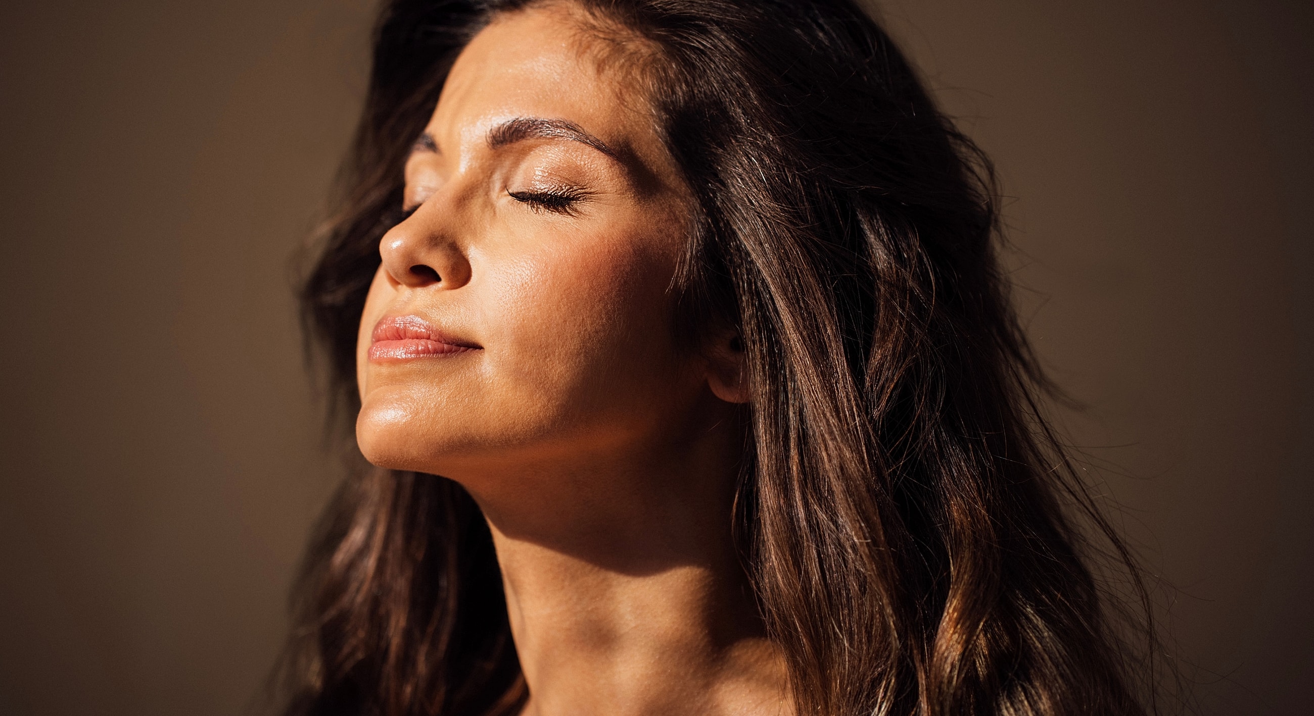 Woman enjoying peaceful moment with closed eyes